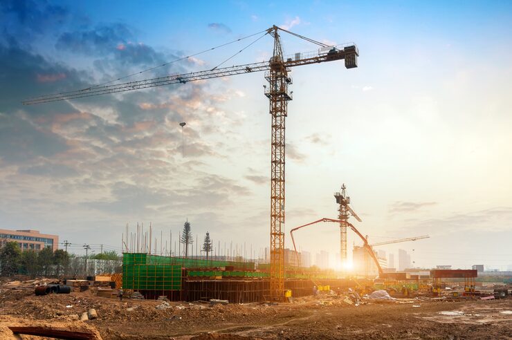 construction-site-silhouettes-construction-industry-workers-scaffolding-against-sunset-light_11208-2632
