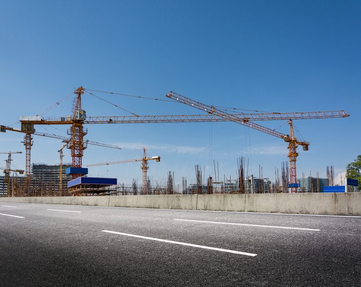 construction-site-with-cranes-against-blue-sky_1127-2304